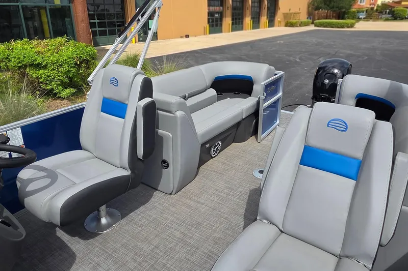 Slide: The Image of 2026 Sun Tracker Party Barge 22 DLX interior with plush seating and modern design. - 5