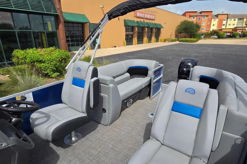 Slide: The Image of 2026 Sun Tracker Party Barge 22 DLX pontoon boat with modern seating and sleek design. - 10