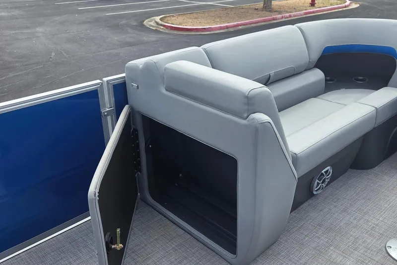 Slide: The Image of 2026 Sun Tracker Party Barge 22 DLX with open storage compartment and comfortable seating. - 3