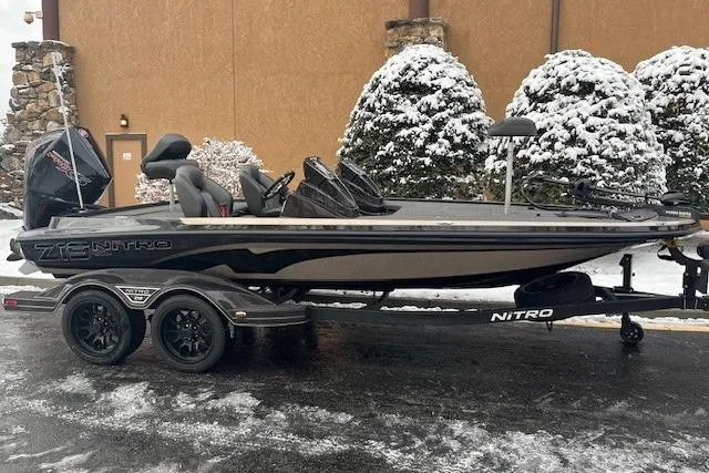 The Image of 2026 Nitro Z19 XL boat on trailer, parked in snowy setting. - 0