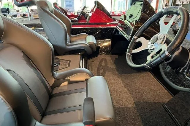 Slide: The Image of Interior of 2026 Nitro Z19 XL boat featuring sleek seats and modern steering wheel design. - 7