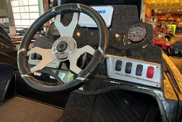 Slide: The Image of Steering console of 2026 Nitro Z19 XL boat with modern controls and dashboard. - 5
