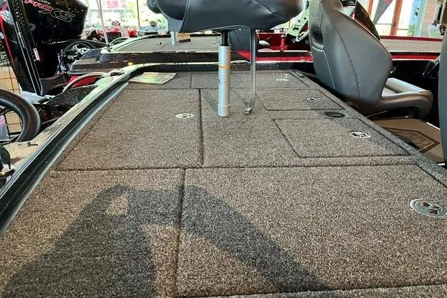 Slide: The Image of 2026 Nitro Z19 XL boat interior with carpeted deck and seating. - 6