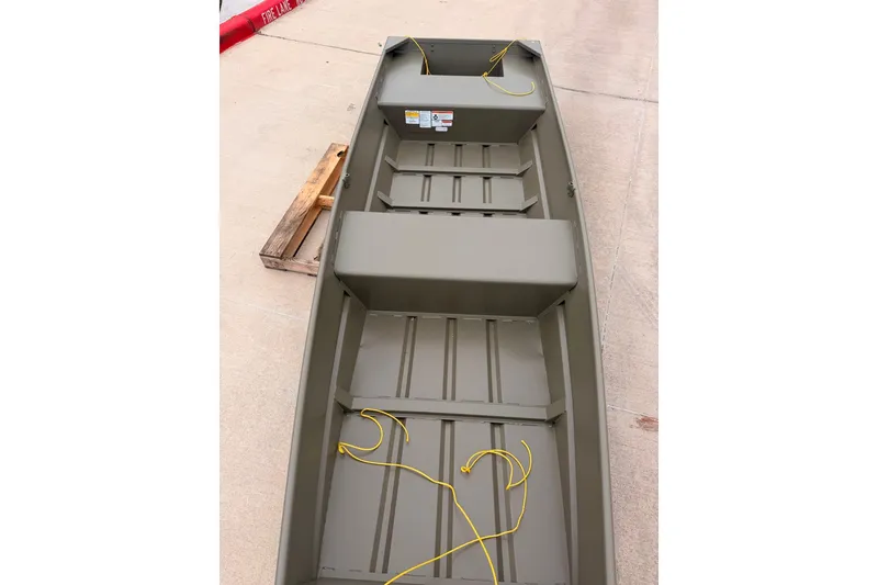 Slide: The Image of 2026 Tracker Grizzly 14 Jon boat, interior view with yellow ropes on seats. - 3