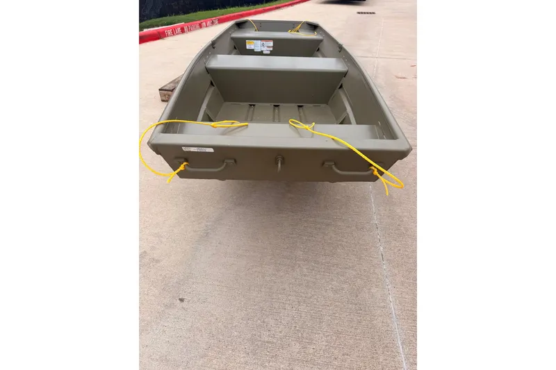 Slide: The Image of 2026 Tracker Grizzly 14 Jon boat on concrete surface with yellow ropes. - 4