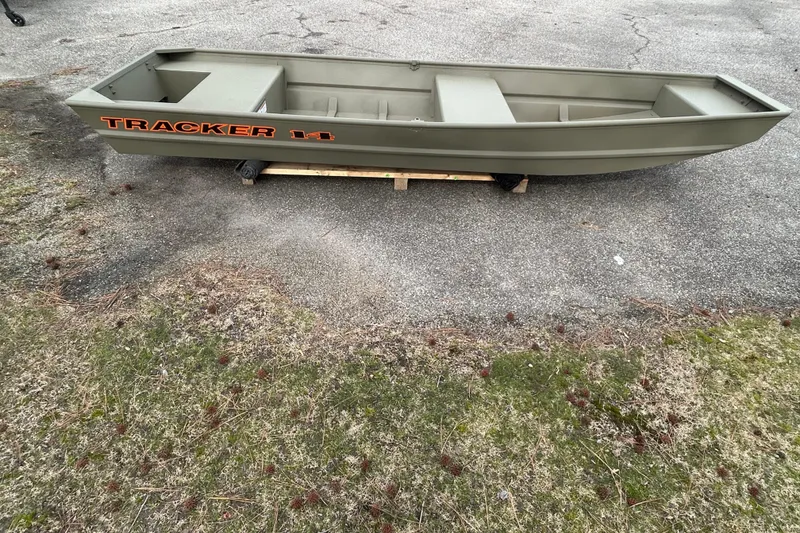 Slide: The Image of 2026 Tracker Grizzly 14 Jon boat on pavement, showcasing its sturdy design and spacious interior. - 6