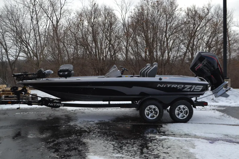 The Image of 2026 Nitro Z19 XL Pro boat on trailer, parked in snowy landscape. - 0