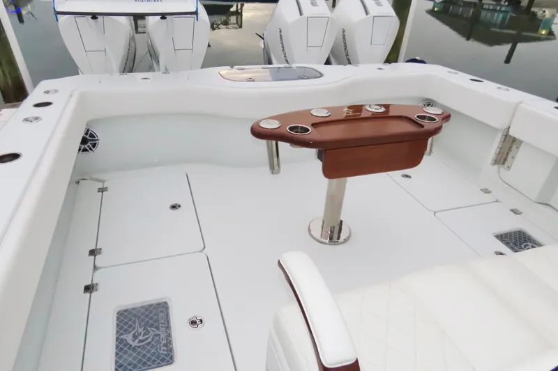 Slide: The Image of 2024 Freeman 38 boat interior with sleek seating and wooden table. - 9