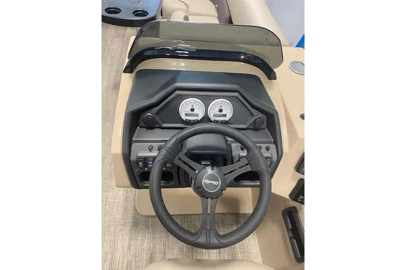 Slide: The Image of 2026 Bentley Pontoons Legacy 223 Navigator dashboard with steering wheel and gauges. - 12