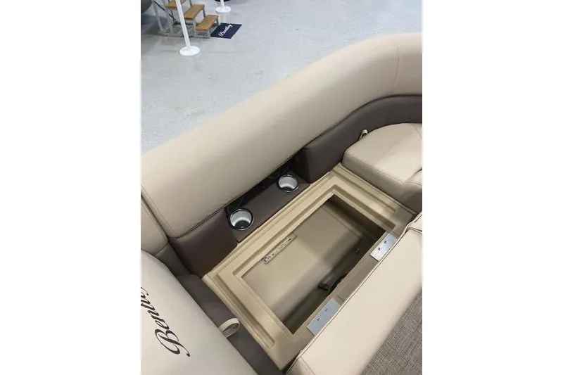 Slide: The Image of 2026 Bentley Pontoons Legacy 223 Navigator interior seating with storage and cup holders. - 13