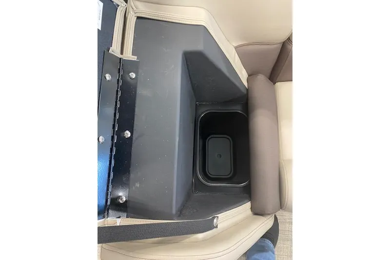Slide: The Image of Storage compartment in 2026 Bentley Pontoons Legacy 223 Navigator boat, featuring beige and brown seating. - 16