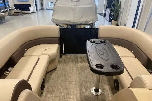 Slide: The Image of 2026 Bentley Pontoons Legacy 223 Navigator interior with beige seating and table. - 20