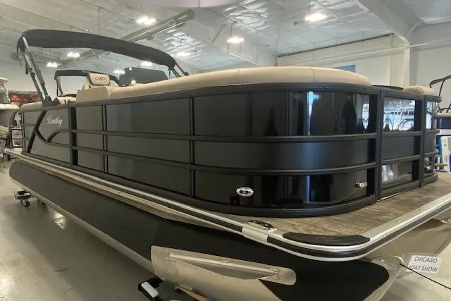 Slide: The Image of 2026 Bentley Pontoons Legacy 223 Navigator at Chicago Boat Show, sleek black design. - 3