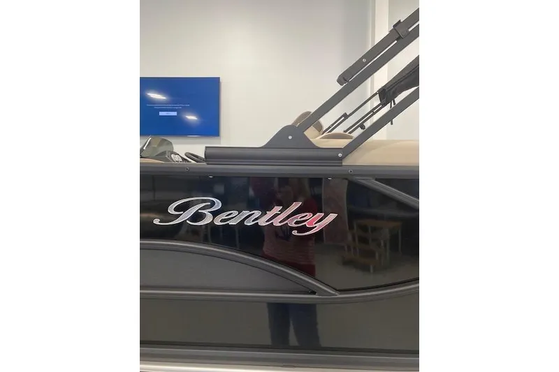 Slide: The Image of 2026 Bentley Pontoons Legacy 223 Navigator with sleek design and logo detail. - 5