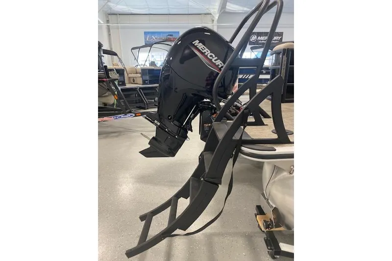 Slide: The Image of 2026 Bentley Pontoons Legacy 223 Navigator with Mercury outboard motor in showroom. - 7