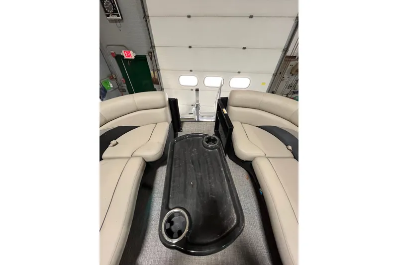 Slide: The Image of 2021 Barletta Cabrio 22UC interior with beige seating and central table. - 11