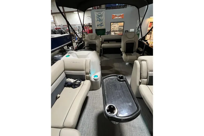Slide: The Image of 2021 Barletta Cabrio 22UC pontoon boat interior with seating and table. - 14
