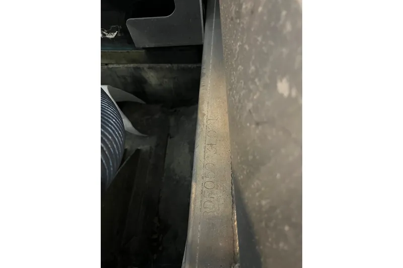 Slide: The Image of Close-up of a Barletta Cabrio 22UC 2021 serial number on metal surface. - 18