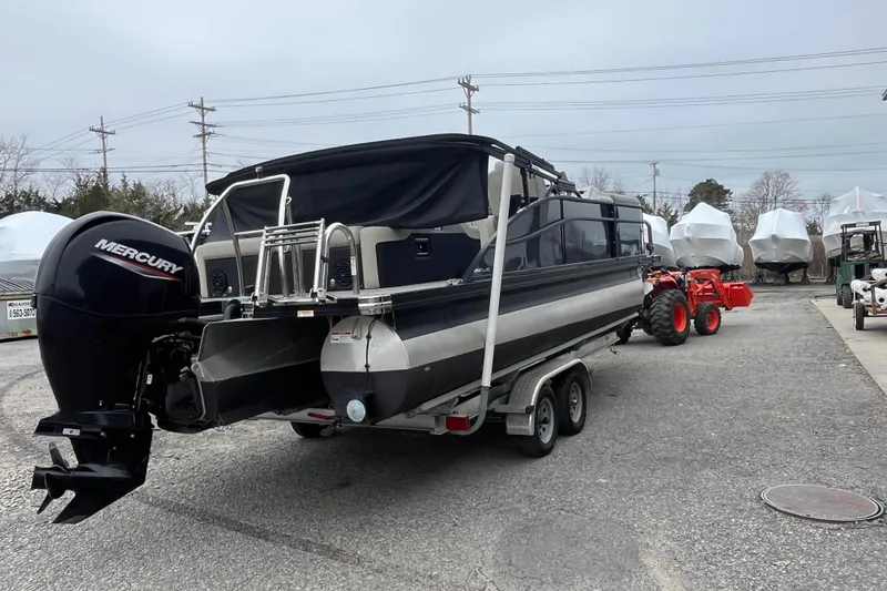 Slide: The Image of 2021 Barletta Cabrio 22UC pontoon boat on trailer with Mercury outboard engine. - 3