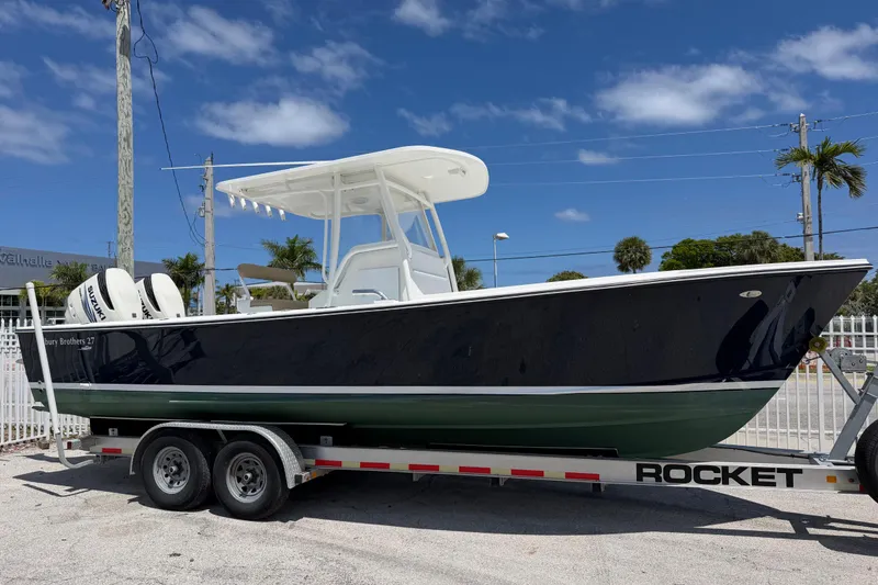 The Image of 2015 Albury Brothers 27 boat on trailer under clear blue sky. - 0