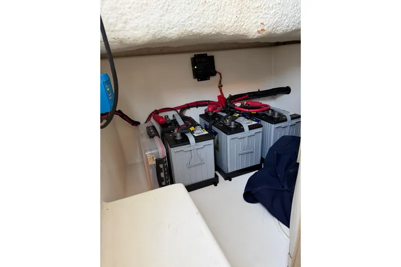 Slide: The Image of Battery compartment of a 2015 Albury Brothers 27 boat with wiring and equipment. - 13