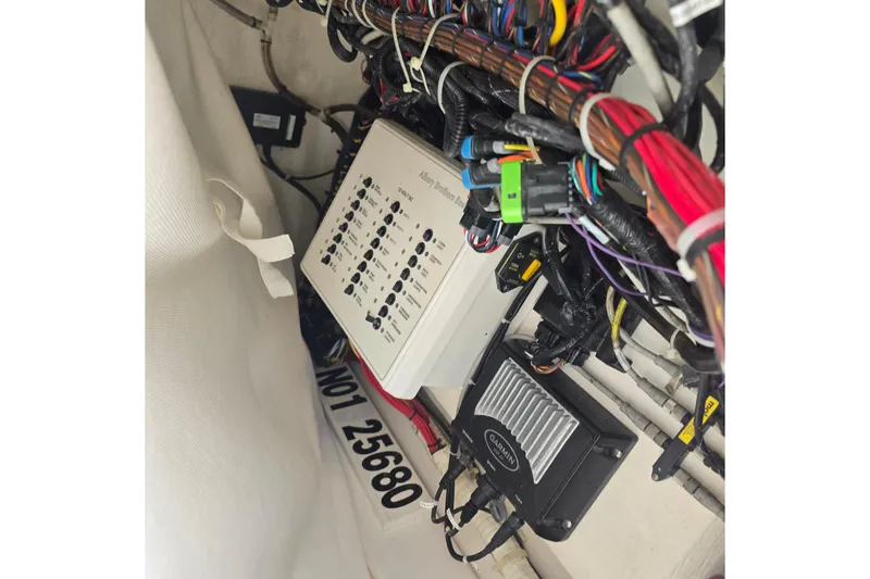 Slide: The Image of Electrical wiring and control panel inside a 2015 Albury Brothers 27 boat. - 18