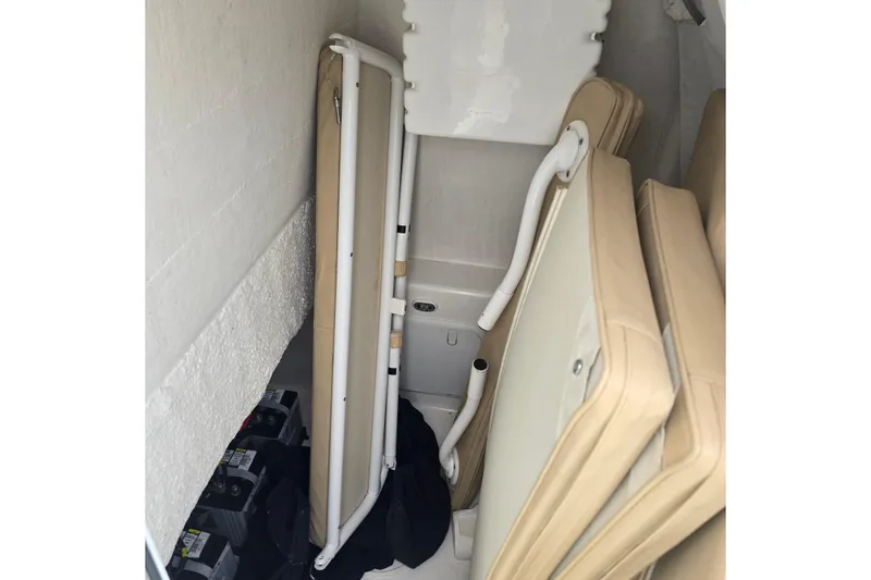 Slide: The Image of Storage area in a 2015 Albury Brothers 27 boat with folded seats and batteries. - 21