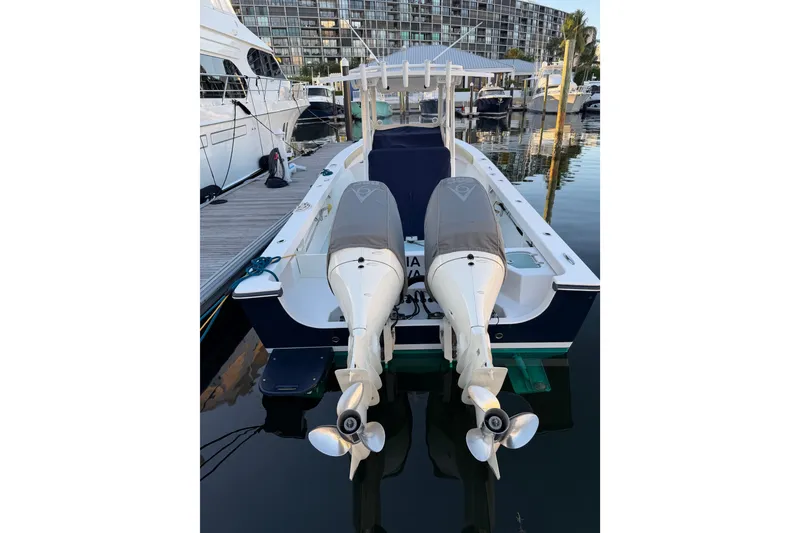 Slide: The Image of 2015 Albury Brothers 27 boat with dual outboard engines docked at marina. - 3