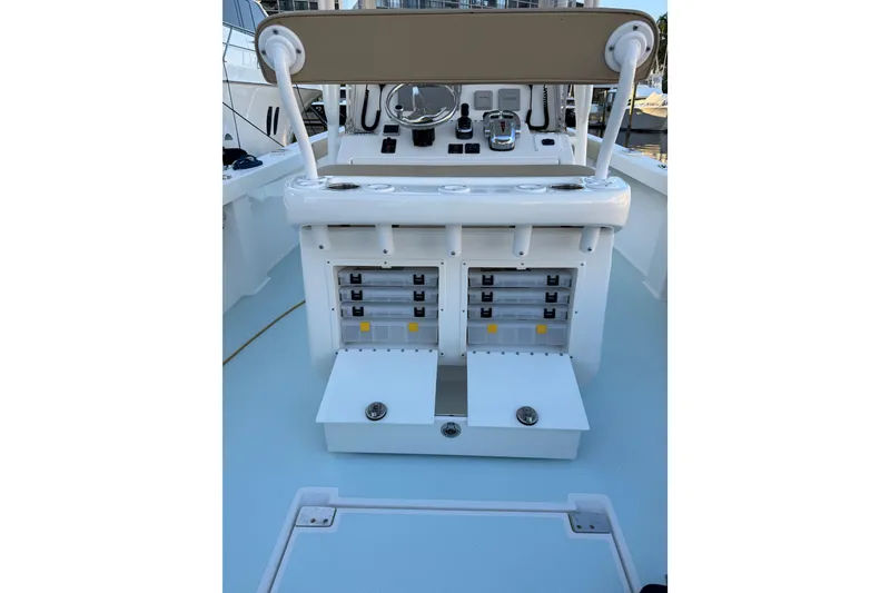 Slide: The Image of 2015 Albury Brothers 27 boat console with storage compartments and controls. - 9