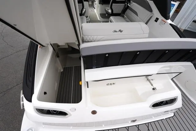Slide: The Image of 2026 Sea Ray SLX 260 boat interior with seating and storage compartments. - 16