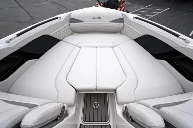 Slide: The Image of 2026 Sea Ray SLX 260 boat interior with luxurious white seating and sleek design. - 19