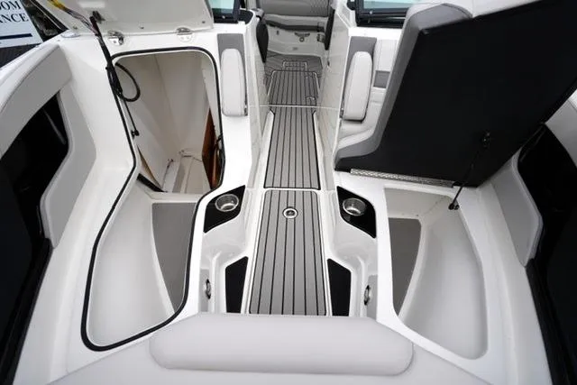 Slide: The Image of 2026 Sea Ray SLX 260 boat interior with sleek seating and storage compartments. - 20
