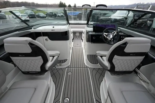 Slide: The Image of Interior of 2026 Sea Ray SLX 260 boat, featuring luxurious seating and modern dashboard. - 22