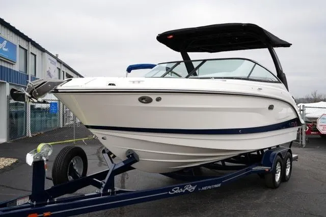 Slide: The Image of 2026 Sea Ray SLX 260 boat on trailer, displayed outdoors. - 9