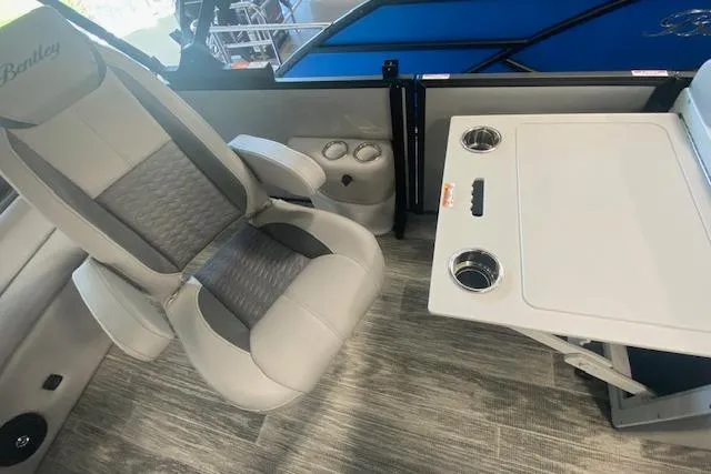 Slide: The Image of 2026 Bentley Pontoons Legacy 223 Swingback interior with luxury seating and table. - 19