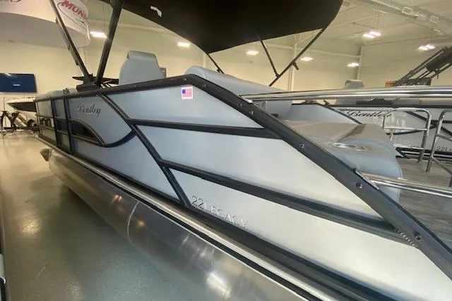 Slide: The Image of 2026 Bentley Pontoons Legacy 223 Swingback in showroom, sleek design with modern features. - 20
