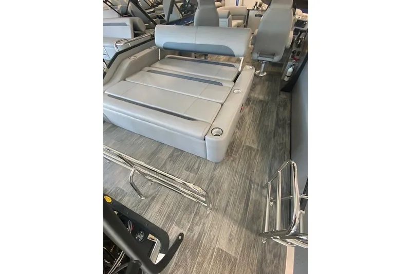 Slide: The Image of 2026 Bentley Pontoons Legacy 223 Swingback interior with gray seating and modern design. - 8