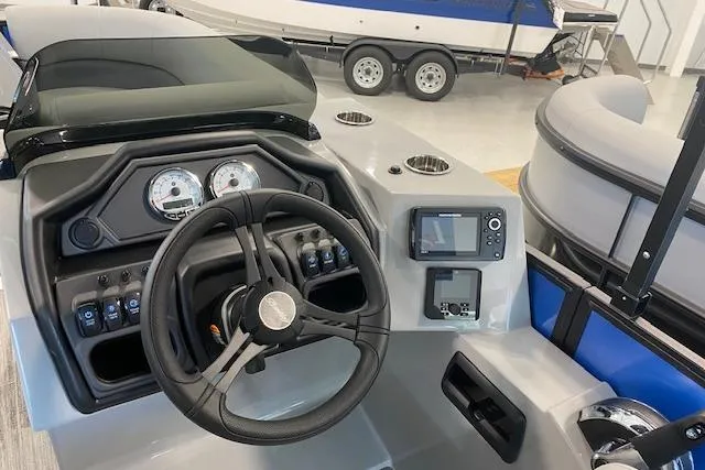 Slide: The Image of 2026 Bentley Pontoons Legacy 223 Swingback dashboard with steering wheel and control panel. - 12