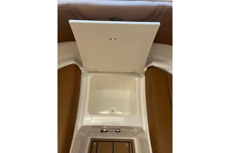Slide: The Image of Interior storage compartment of 2025 Chaparral 247 SSX boat, featuring sleek design. - 14