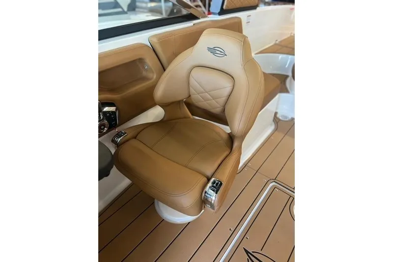 Slide: The Image of Luxurious tan seat in 2025 Chaparral 247 SSX boat interior. - 17
