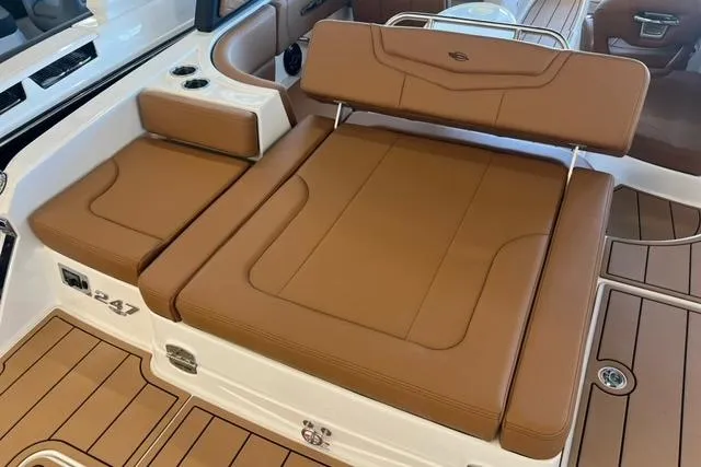 Slide: The Image of 2025 Chaparral 247 SSX boat with luxurious brown seating and sleek design. - 36