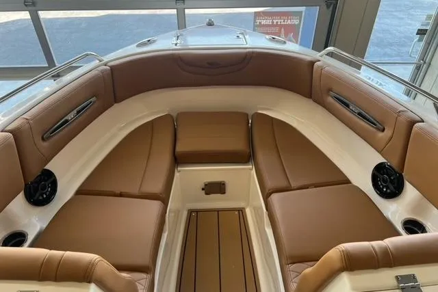Slide: The Image of 2025 Chaparral 247 SSX boat interior with tan leather seating and modern design. - 8