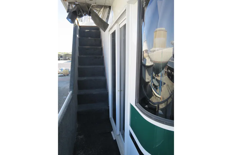 Slide: The Image of 2001 Sumerset Houseboat deck with maintenance supplies and equipment. - 11