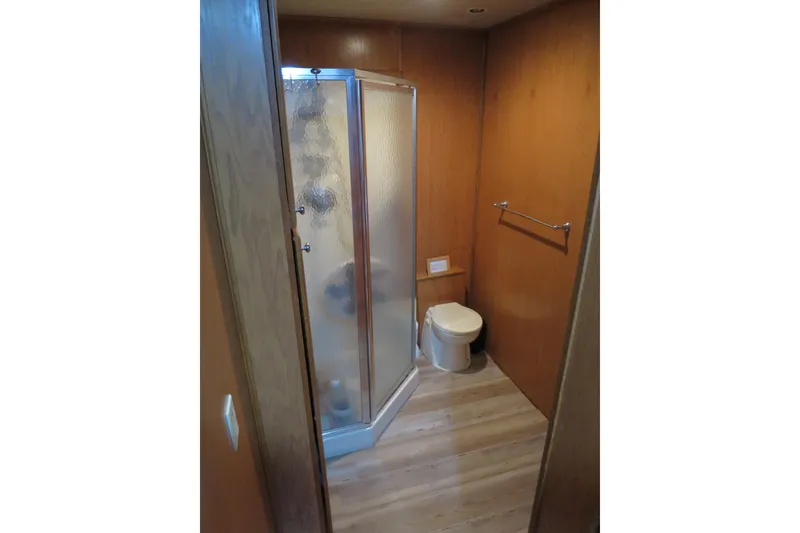 Slide: The Image of Cozy bedroom interior of a 2001 Sumerset houseboat with a neatly made bed. - 24