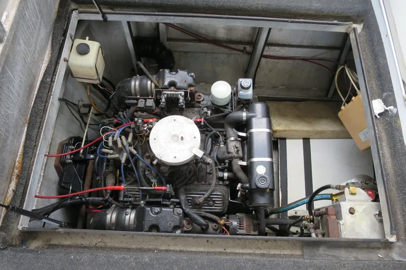 Slide: The Image of Engine compartment of a 2001 Sumerset Houseboat, showcasing detailed mechanical components. - 27