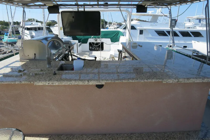 Slide: The Image of Underneath view of a 2001 Sumerset Houseboat, showing propeller and structural details. - 6