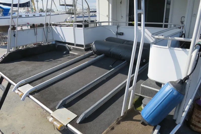 Slide: The Image of 2001 Sumerset houseboat deck with spiral staircase and safety railings. - 9