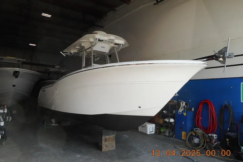 The Image of 2014 Sea Fox 256 Commander boat in indoor storage facility. - 1