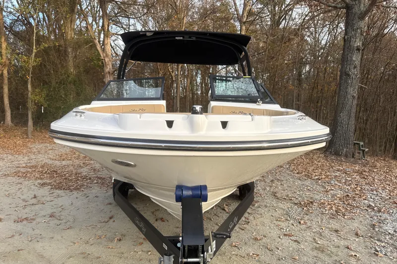 Slide: The Image of 2023 Sea Ray SPX 210 boat on trailer, parked outdoors, rear view. - 14