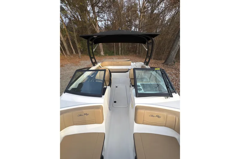 Slide: The Image of 2023 Sea Ray SPX 210 boat interior with tan and black seating. - 19